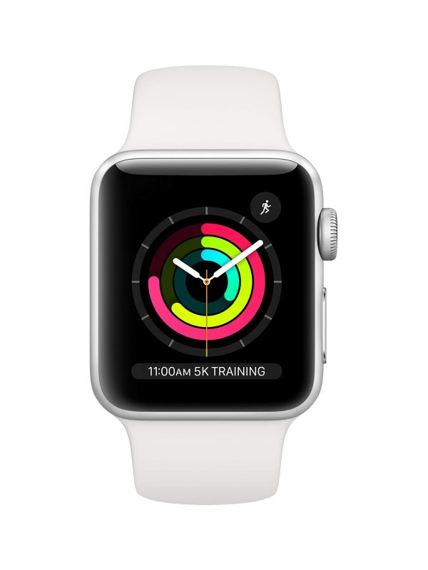 A silver Apple Watch with a white band displays colorful activity rings on its screen and a reminder for 11:00AM 5K TRAINING at the bottom. The watch face also shows the current time.
