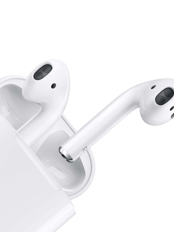A close-up of white wireless earbuds, partially removed from their charging case, showcasing the sleek and modern design.