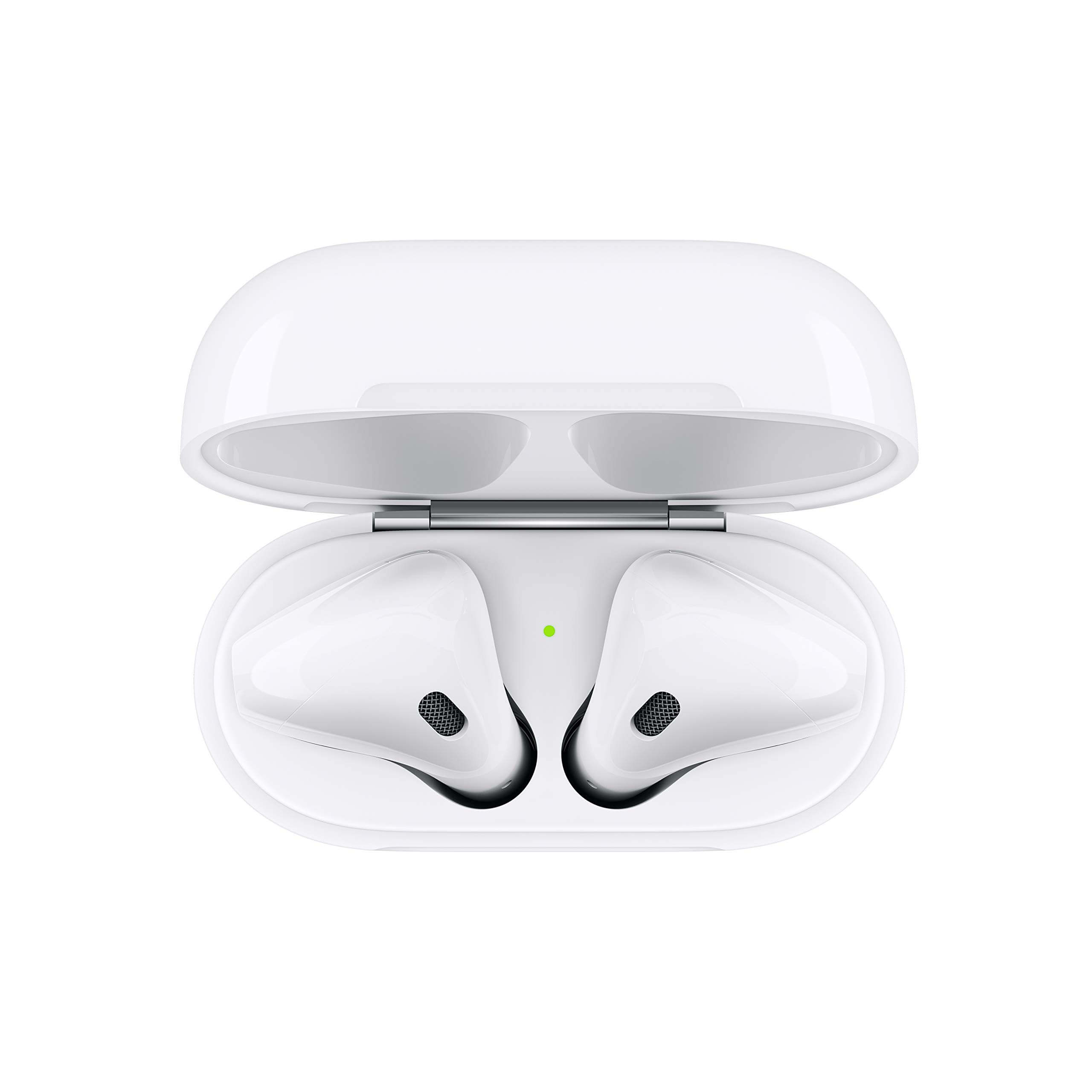A pair of white wireless earbuds are placed inside an open white charging case, viewed from above; a small green indicator light is lit between the earbuds.