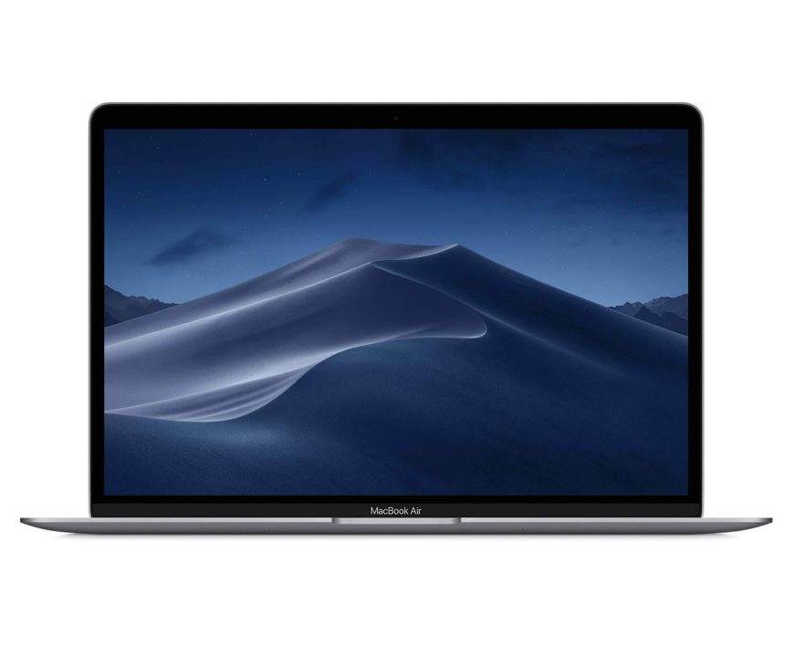 A MacBook Air laptop with a dark screen displaying a night desert landscape with sand dunes and a starry sky.
