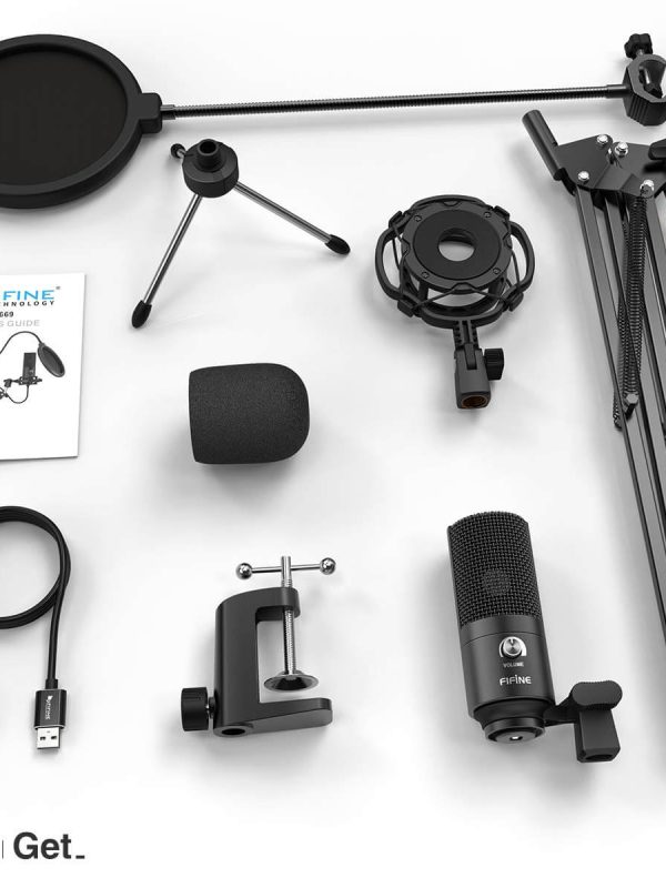 A podcast microphone kit displayed on a white surface, including a microphone, pop filter, shock mount, adjustable arm, desk clamp, foam windscreen, tripod, USB cable, adapter, and a user manual.