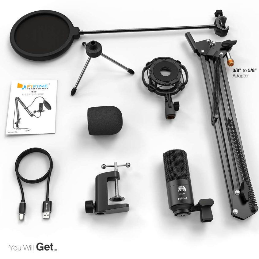 A podcast microphone kit displayed on a white surface, including a microphone, pop filter, shock mount, adjustable arm, desk clamp, foam windscreen, tripod, USB cable, adapter, and a user manual.