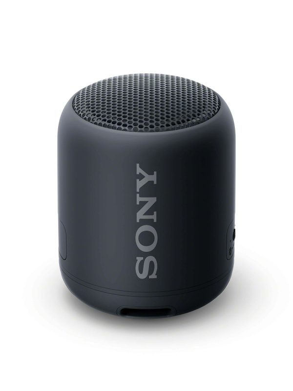 A compact, cylindrical black Sony portable Bluetooth speaker with a mesh top grille and the SONY logo printed vertically on its side, shown against a plain white background.