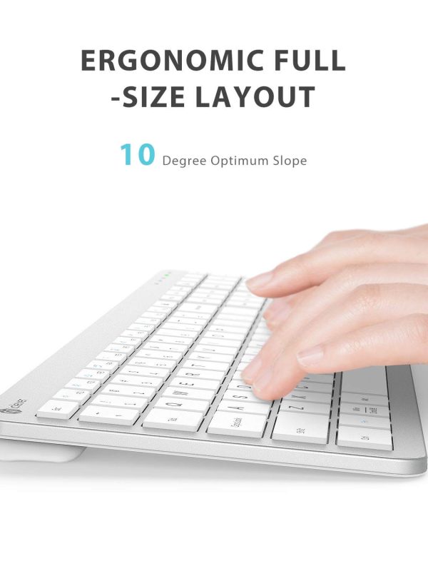 A hand typing on a white, slim, full-size keyboard with an ergonomic 10-degree slope. Text above highlights the Ergonomic Full-Size Layout and 10 Degree Optimum Slope.