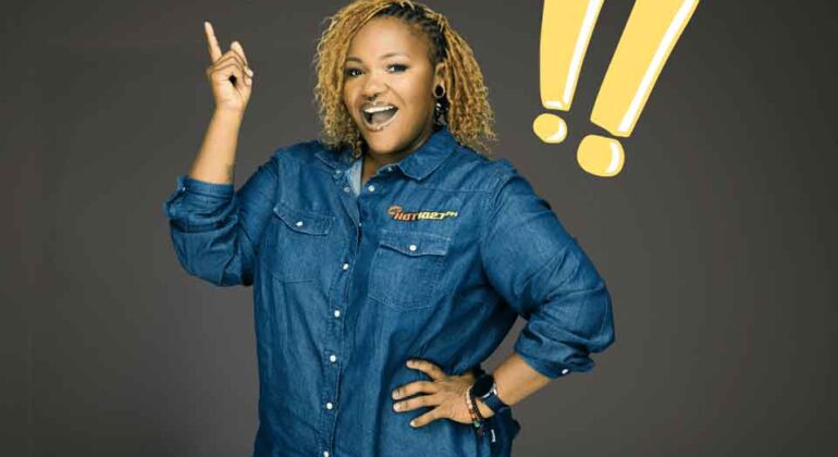 A smiling woman in a denim shirt points upward, with a cartoon turtle and yellow exclamation marks illustrated beside her on a dark background.