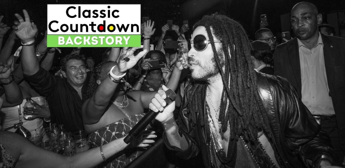 Black and white photo of a singer with dreadlocks and sunglasses performing closely to an excited crowd, capturing the energy as "Love is in the Air" plays; Classic Countdown Backstory text appears in the top left corner.