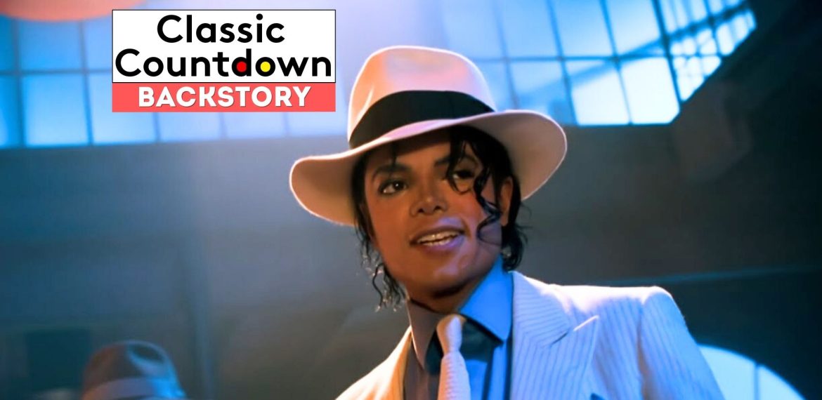 A person in a white fedora, pinstripe suit, and tie stands under dramatic lighting with princely flair. The text Classic Countdown Backstory appears in the upper left corner.