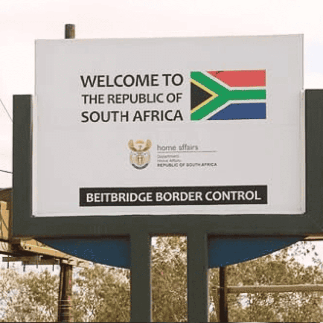 A sign reads Welcome to the Republic of South Africa with the South African flag. Below, it says Beitbridge Border Control, displaying the Department of Home Affairs logo—hinting at new business opportunities beyond the border.