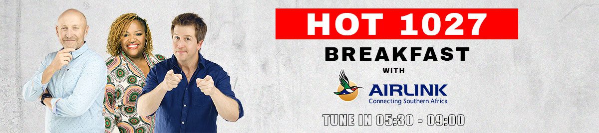 Three radio hosts stand smiling next to the text: hot 1027 breakfast with Airlink. Tune in 06:00 - 09:00. The background is light gray, featuring Airlink’s colorful bird logo.