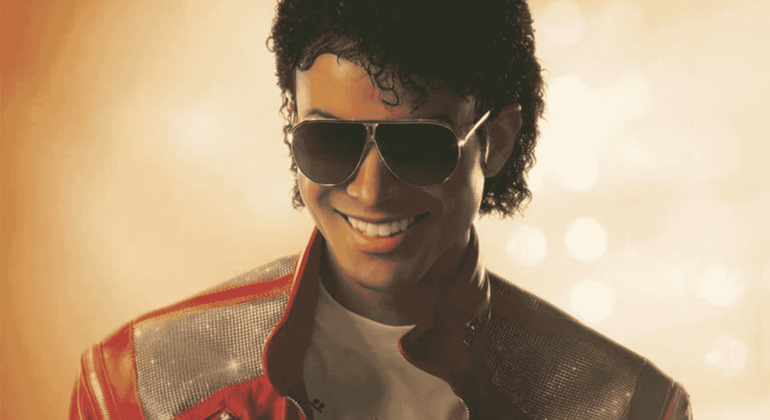 A person with curly hair wearing sunglasses, a red and silver jacket, and a white shirt smiles against a golden, softly lit background, evoking the vibrant style of Miriam Makeba.